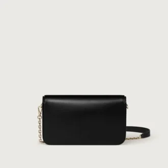 mini kettenhandtasche double c de cartier schwarzes kalbsleder gold und schwarz emaille finish cartier 2 330x330 - Mini-Kettenhandtasche, Double C de Cartier &ndash; Schwarzes Kalbsleder, Gold- und Schwarz-Emaille-Finish &ndash; Cartier